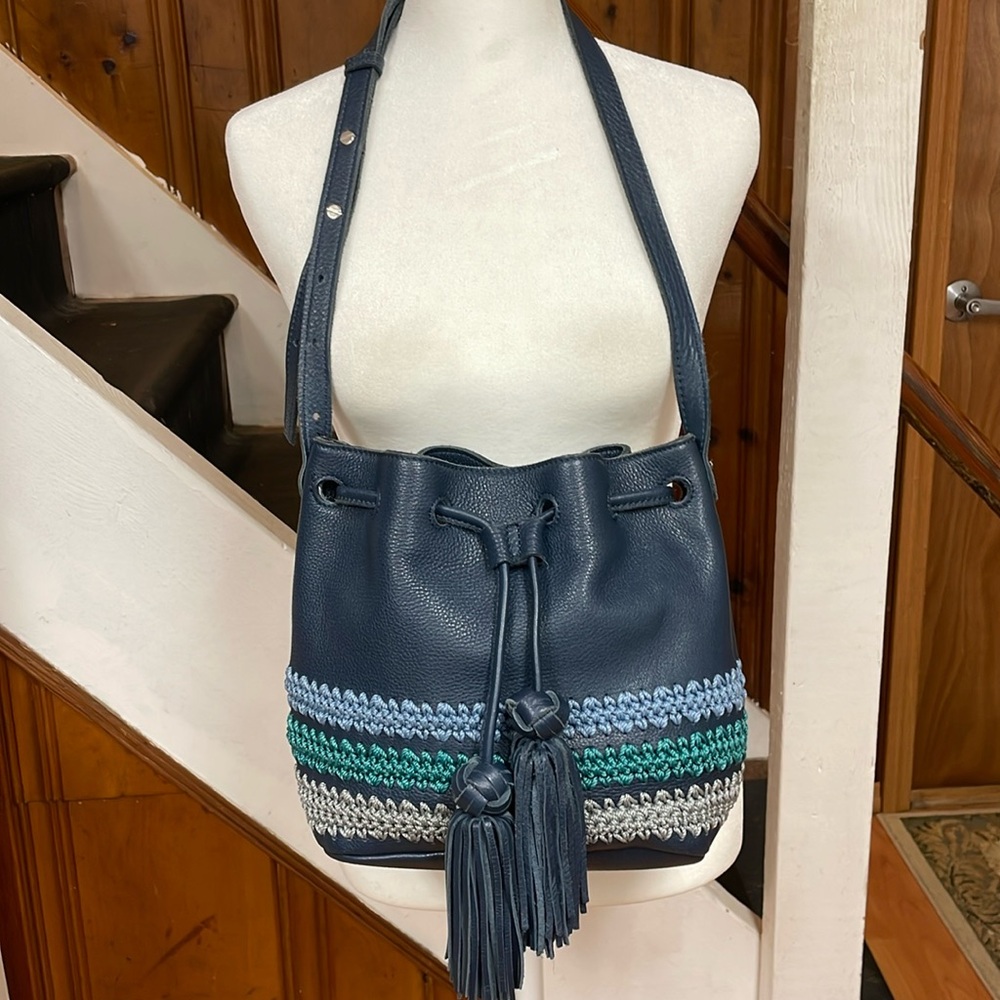 The Sak Sayulita blue Leather & Crochet Drawstring Hobo Bucket Bag